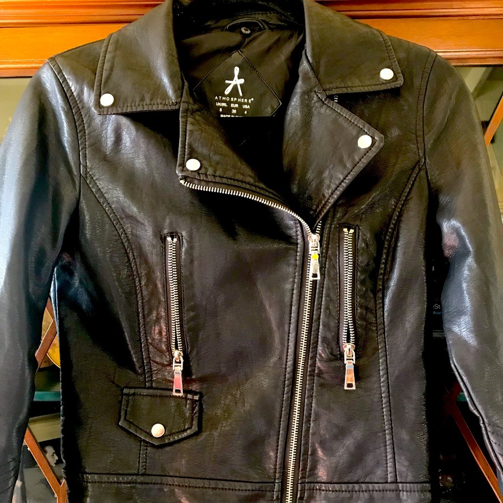 Faux leather biker jacket with faux fur collar that is removable.